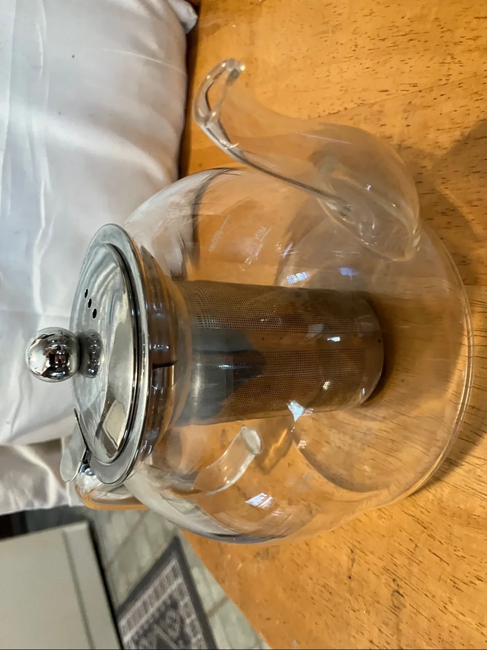 Like new. French press style glass tea pot with stainless steel pieces